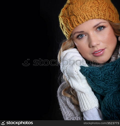 Portrait of beautiful woman wearing winter accessories