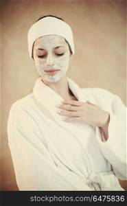 portrait of beautiful woman with cosmetic mask on face in spa and wellness salon. woman in spa with cosmetic mask
