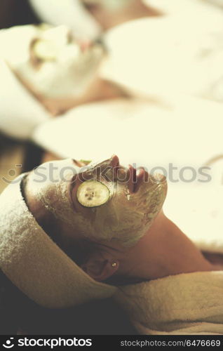 portrait of beautiful woman with cosmetic mask on face in spa and wellness salon. woman in spa with cosmetic mask