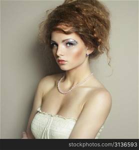 Portrait of beautiful woman with elegant hairstyle. Fashion photo