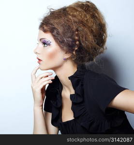 Portrait of beautiful woman with elegant hairstyle. Fashion photo