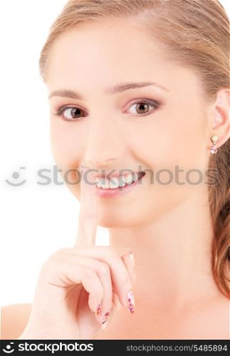 portrait of beautiful woman with finger on lips
