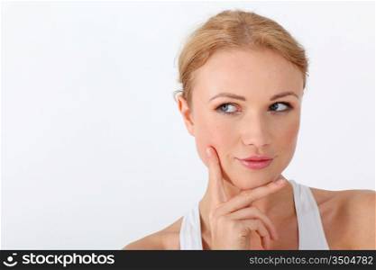 Portrait of beautiful woman with hand on chin