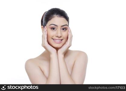Portrait of beautiful woman with head in hands against white background
