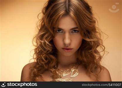 portrait of beautiful woman with long curly hair
