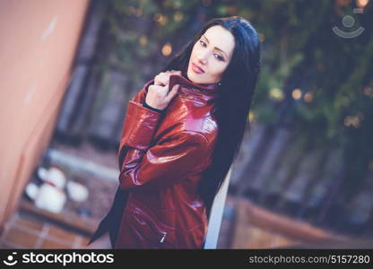 Portrait of beautiful woman with long hair in urban background