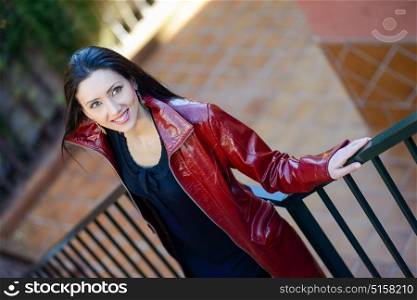 Portrait of beautiful woman with long hair in urban background