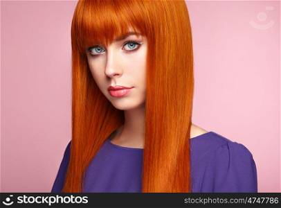 Portrait of beautiful woman with red hair. Colored long haircut. Perfect make-up. Girl in elegant violet dress. Red wig. Fashion photo