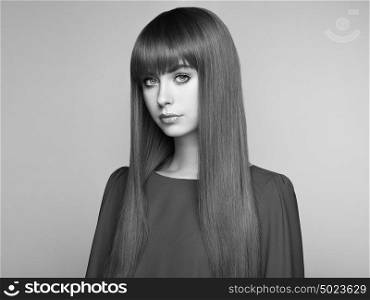 Portrait of beautiful woman with red hair. Colored long haircut. Perfect make-up. Girl in elegant violet dress. Red wig. Fashion photo. Black and White photo