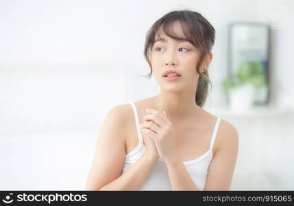 Portrait of beautiful young asian woman makeup of cosmetic, girl happy and smile attractive, face of beauty perfect with wellness in the bedroom at home with skin care and healthcare concept.