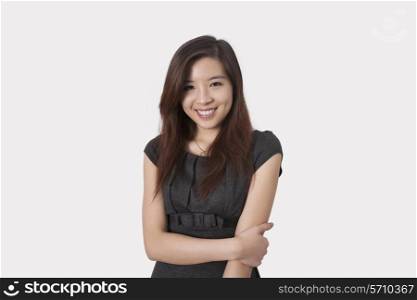 Portrait of beautiful young businesswoman smiling over white background