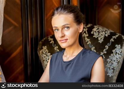 Portrait of beautiful young caucasian business woman looking at camera at home office. Portrait of beautiful young caucasian business woman