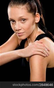 Portrait of beautiful young Caucasian woman doing stretching exercises pose