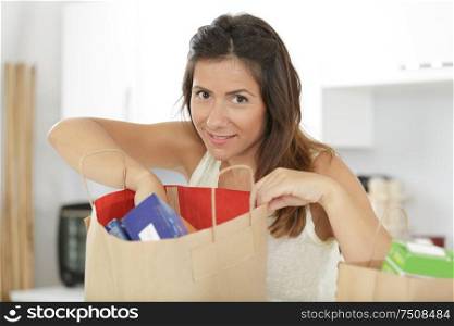 portrait of beautiful young woman grocery shopping bag