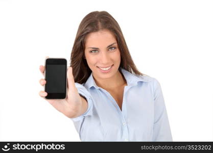 Portrait of beautiful young woman holding smartphone