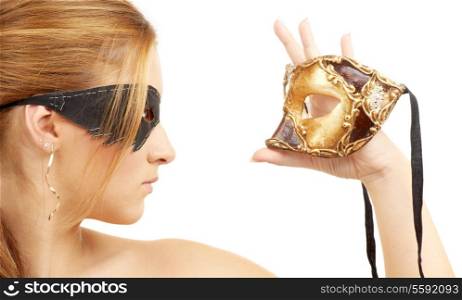 portrait of beautiful young woman holding venetian carnival mask