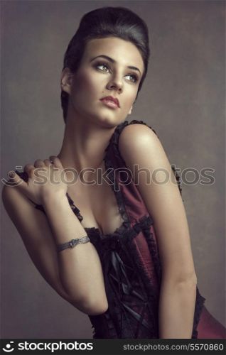 portrait of beautiful young woman in elegant old fashion dress , with false color on grunge background