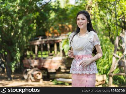 portrait of beautiful young woman in Thai traditional dress
