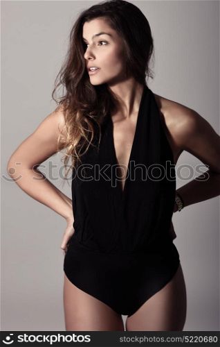 Portrait of beautiful young woman, model of fashion, wearing casual clothes. Studio shot