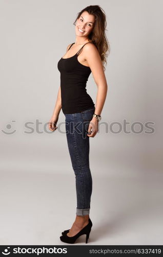 Portrait of beautiful young woman, model of fashion, wearing casual clothes. Studio shot