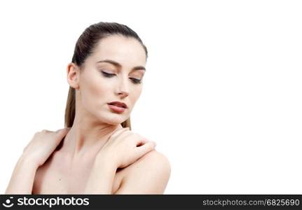 Portrait of Beautiful Young Woman Naked with Long Brown Hair on the White Background. Waist Up. Advertising Space