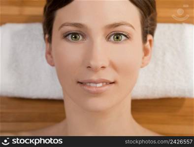 Portrait of beautiful young woman on a spa relaxed after a spa treatment