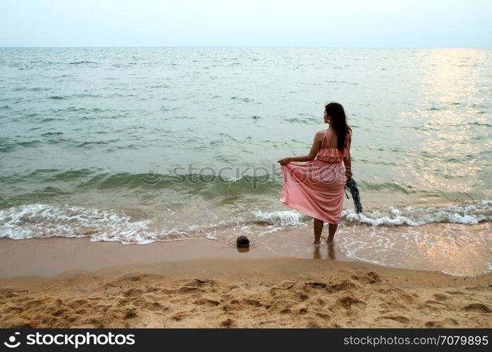 portrait of beautiful young woman on beach