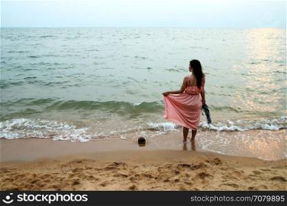portrait of beautiful young woman on beach