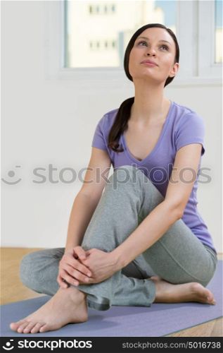 Portrait of beautiful young woman relaxing after doing exercise