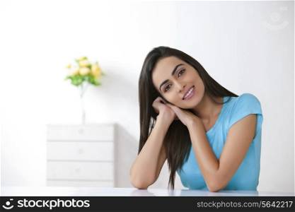 Portrait of beautiful young woman relaxing at home