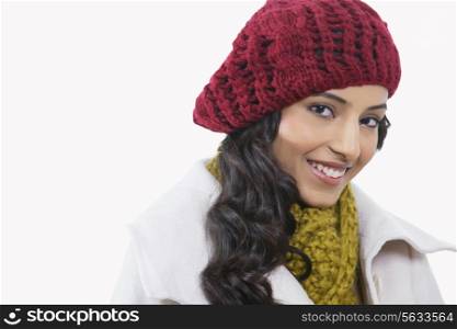 Portrait of beautiful young woman smiling over white background