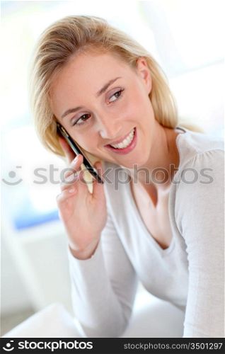 Portrait of beautiful young woman talking on mobile phone