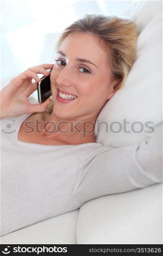 Portrait of beautiful young woman talking on mobile phone