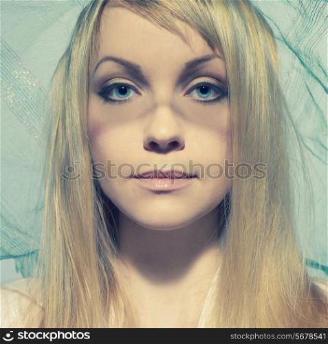 Portrait of beautiful young woman under a veil