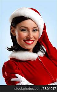 Portrait of beautiful young woman wearing santa claus clothes