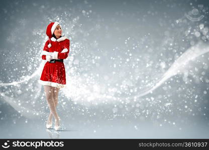 Portrait of beautiful young woman wearing santa claus clothes