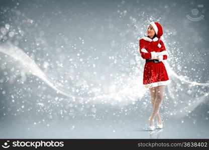 Portrait of beautiful young woman wearing santa claus clothes