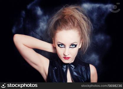 Portrait of beautiful young woman with bright Gothic makeup closeup