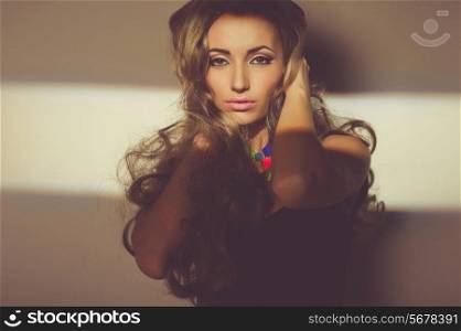 Portrait of beautiful young woman with bright necklace