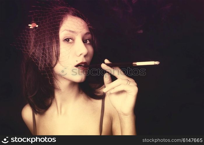 Portrait of beautiful young woman with cigarettel. Japanese style