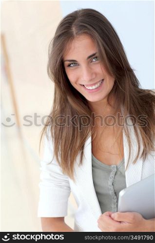 Portrait of beautiful young woman with electronic tablet