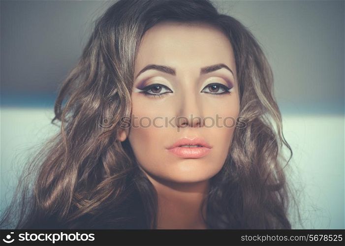 Portrait of beautiful young woman with evening make up
