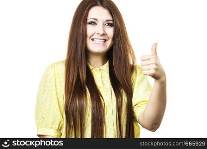 Portrait of beautiful young woman with long brown hair. Female being positive showing thumb up gesture.. Cheerful woman showing thumb up