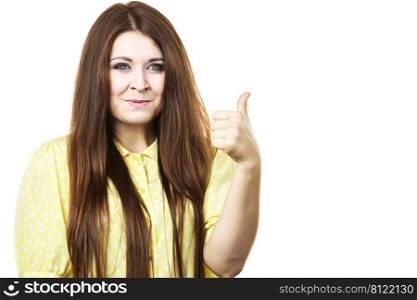 Portrait of beautiful young woman with long brown hair. Female being positive showing thumb up gesture.. Cheerful woman showing thumb up