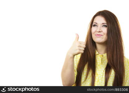 Portrait of beautiful young woman with long brown hair. Female being positive showing thumb up gesture.. Cheerful woman showing thumb up