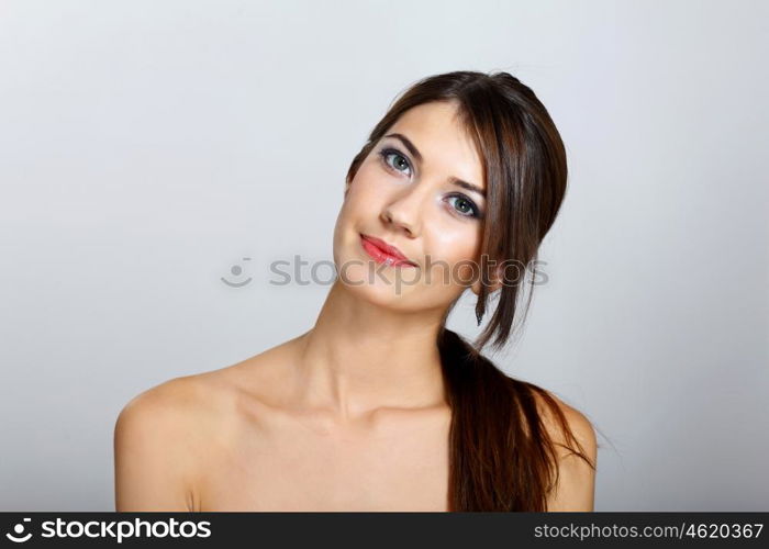 Portrait of beautiful young woman with natural look