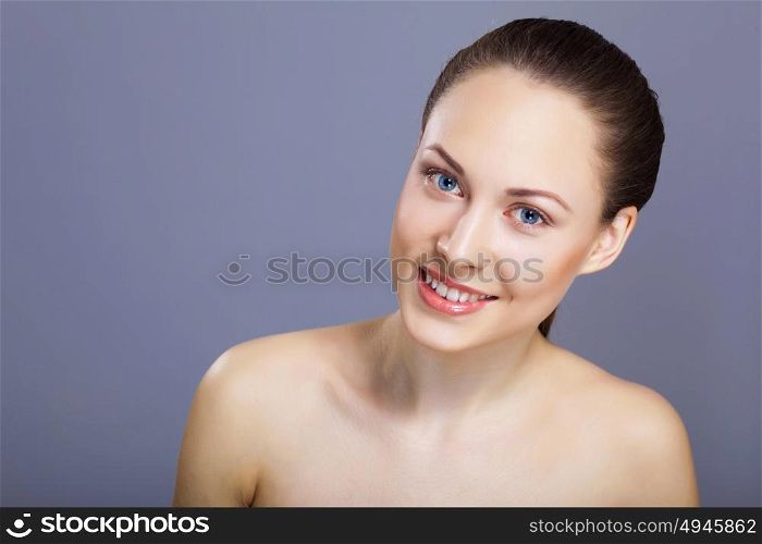 Portrait of beautiful young woman with natural look