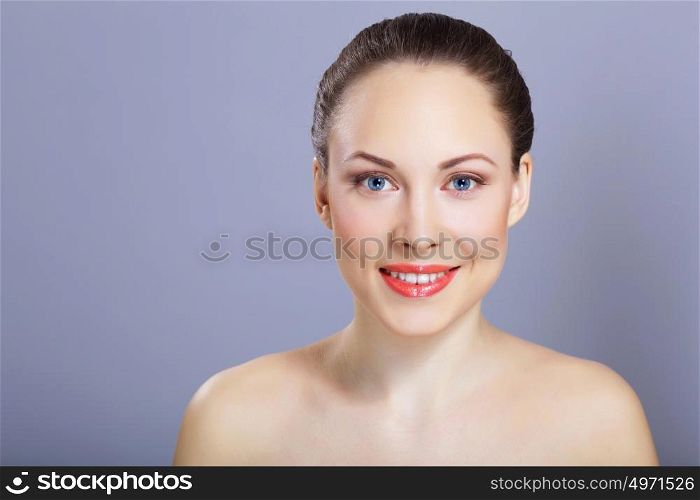 Portrait of beautiful young woman with natural look