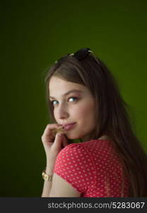 Portrait of beautiful young women isolated on a green background