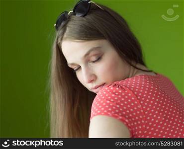 Portrait of beautiful young women isolated on a green background